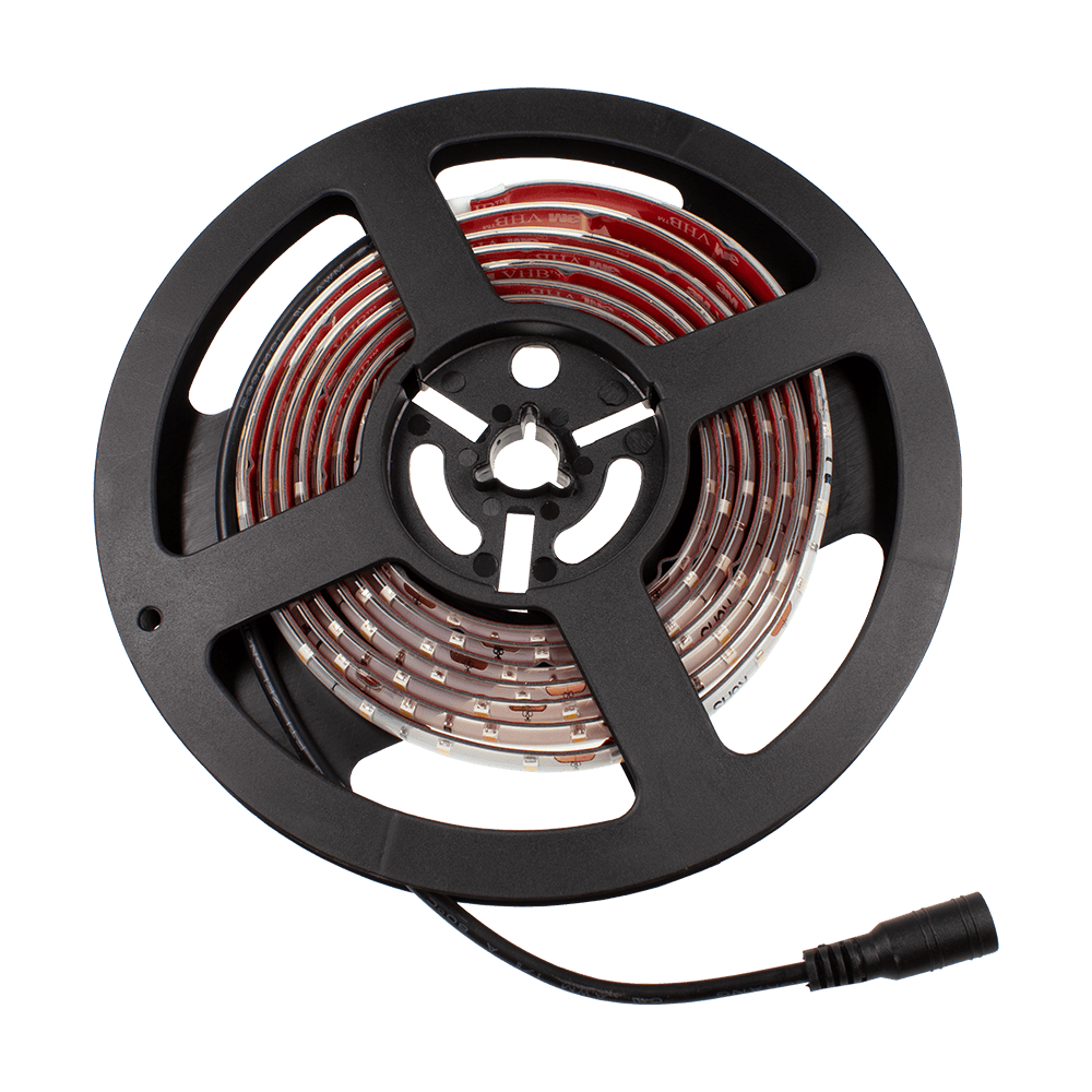 Target-Corona-Ersatzteil-LED-Band-1 Das Bild zeigt eine Rolle mit einem LED-Band als Ersatzteil für das Produkt "Target CORONA Vision". Das LED-Band ist auf einer schwarzen Spule aufgewickelt und hat einen Anschlussstecker.