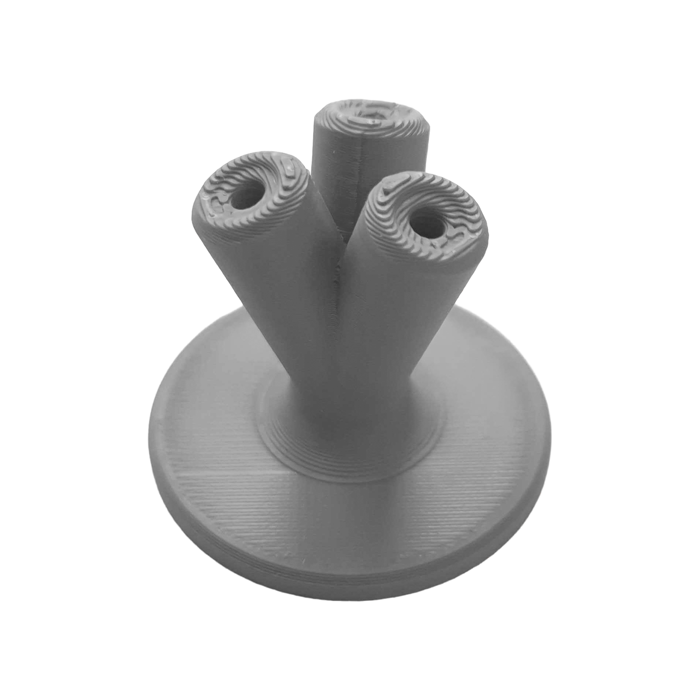 Kompaktowy uchwyt na rzutki NYT Studio Hier sieht man einen kompakten Dart-Halter in Grau. Dieses Zubehör ist praktisch für die Aufbewahrung von Darts.