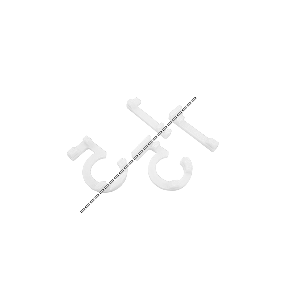 Numery zamienne do tarczy do darta McDart Das Bild zeigt Ersatznummern für eine Dartscheibe von McDart. Die weißen Kunststoffteile sind in der Form von Ziffern gestaltet.