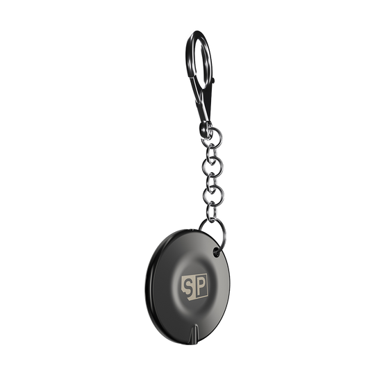 340007_Target_Swiss_Point_Key_Premium_2 Das Bild zeigt den "Target Swiss Point Key Premium", einen runden Schlüsselanhänger mit Kette und Karabinerhaken. Auf der Vorderseite ist ein "SP"-Logo sichtbar.