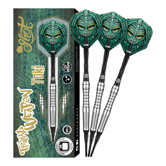 Das Bild zeigt das Produkt "Shot Tribal Weapon Toki Softdarts" mit einer auffälligen, grünen Tribal-Maske auf den Flights. Links ist die Verpackung zu sehen, daneben drei zusammengebaute Softdarts.