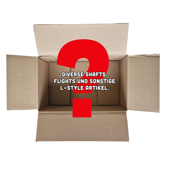 McDart Mystery Box - w stylu L Das Bild zeigt einen offenen Karton mit einem großen roten Fragezeichen darin. In der Mitte steht der Text: "Diverse Shafts, Flights und sonstige L-Style Artikel."