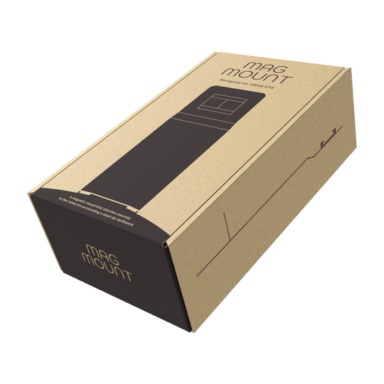 Mocowanie GranDarts Gran Eye Mag Die Abbildung zeigt eine Verpackung des Produkts "GranDarts GranEye Mag Mount Befestigung". Die Schachtel ist aus braunem Karton und trägt die Aufschrift "Mag Mount".