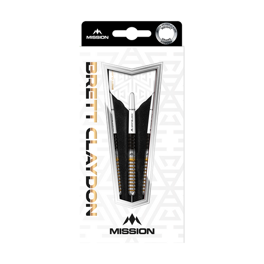 Das Bild zeigt die Verpackung der "Mission Brett Claydon Black Gold Steeldarts - 22g". In der Mitte der Packung sind drei schwarze und goldene Steeldarts sichtbar.