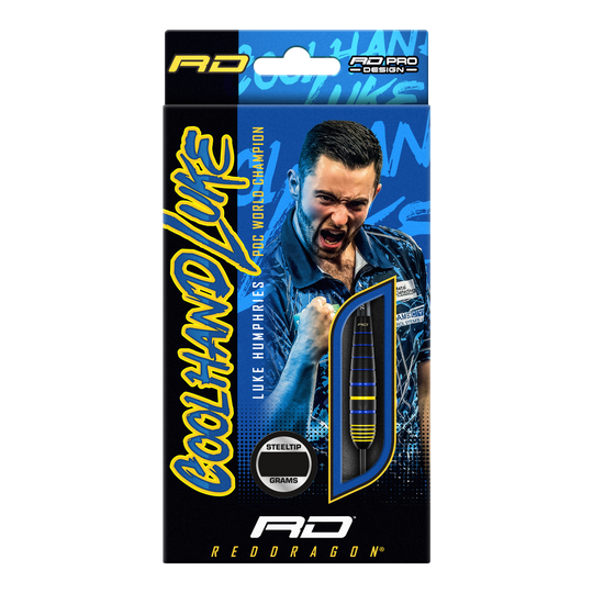 Rzutki Red Dragon Luke Humphries World Champion Brass Steel Auf der Verpackung sind die "Red Dragon Luke Humphries World Champion Brass Steeldarts" abgebildet. Im Hintergrund ist ein jubelnder Spieler zu sehen, daneben ist ein Dartpfeil durch ein Sichtfenster sichtbar.